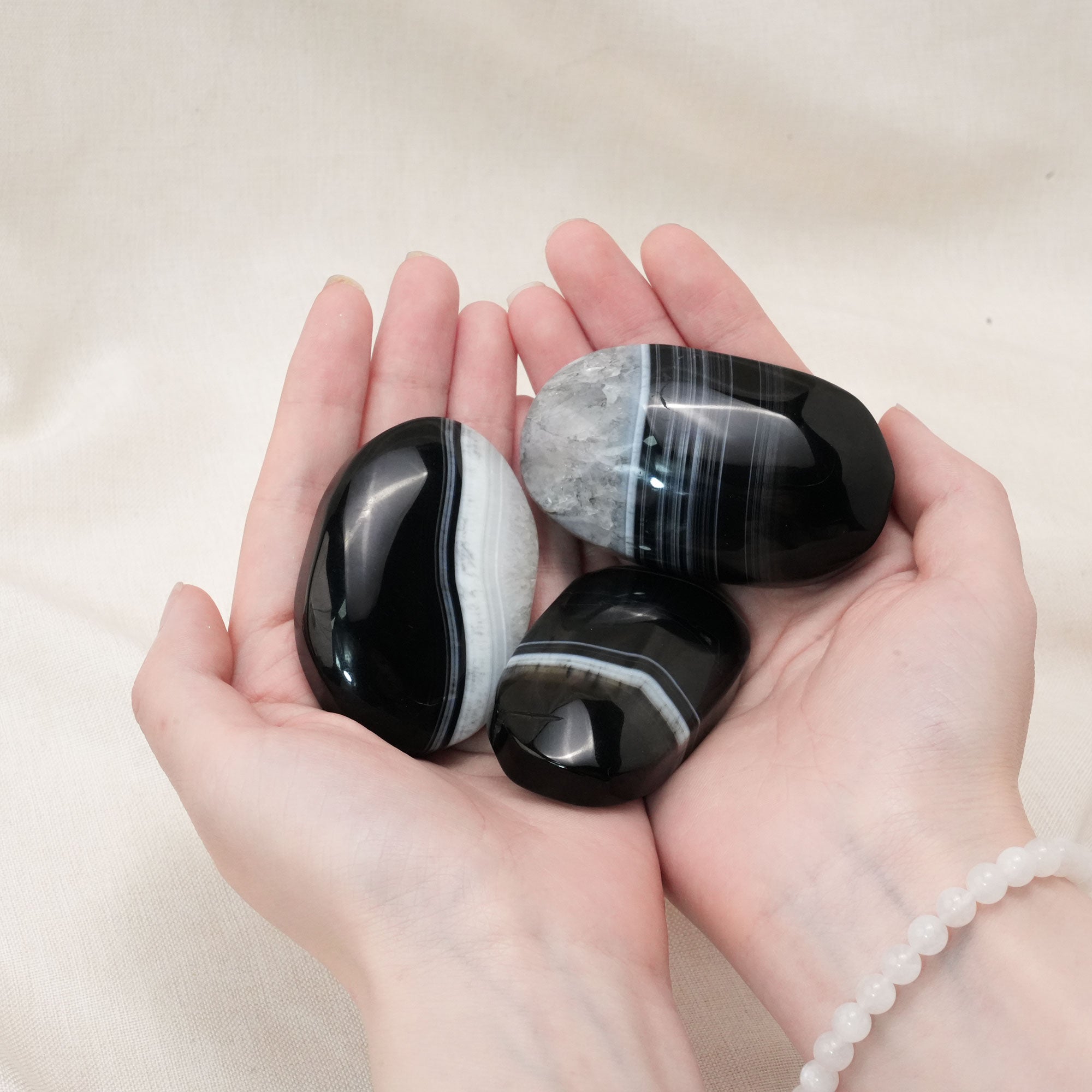 Handcrafted from natural agate, this palm stone promotes emotional stability and enhances spiritual growth