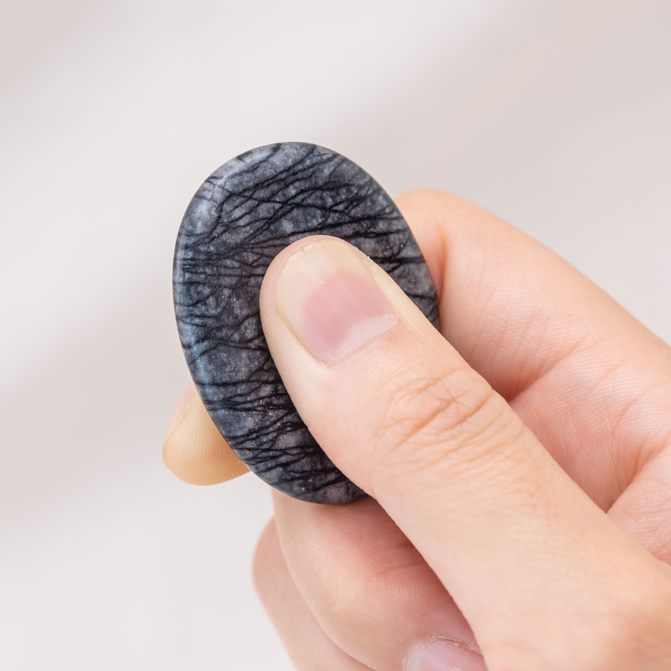The Black Net Worry Stone is ideal for achieving mental clarity and focus