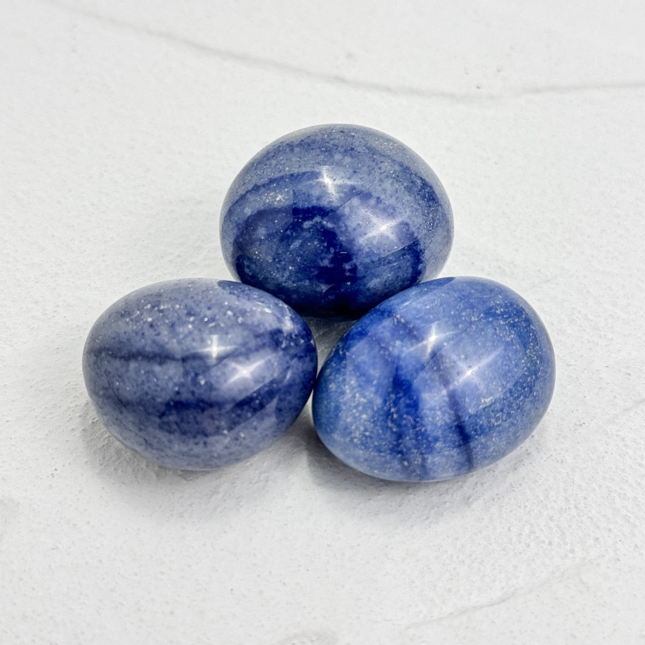 Polished blue aventurine palm stone for calming and intuition