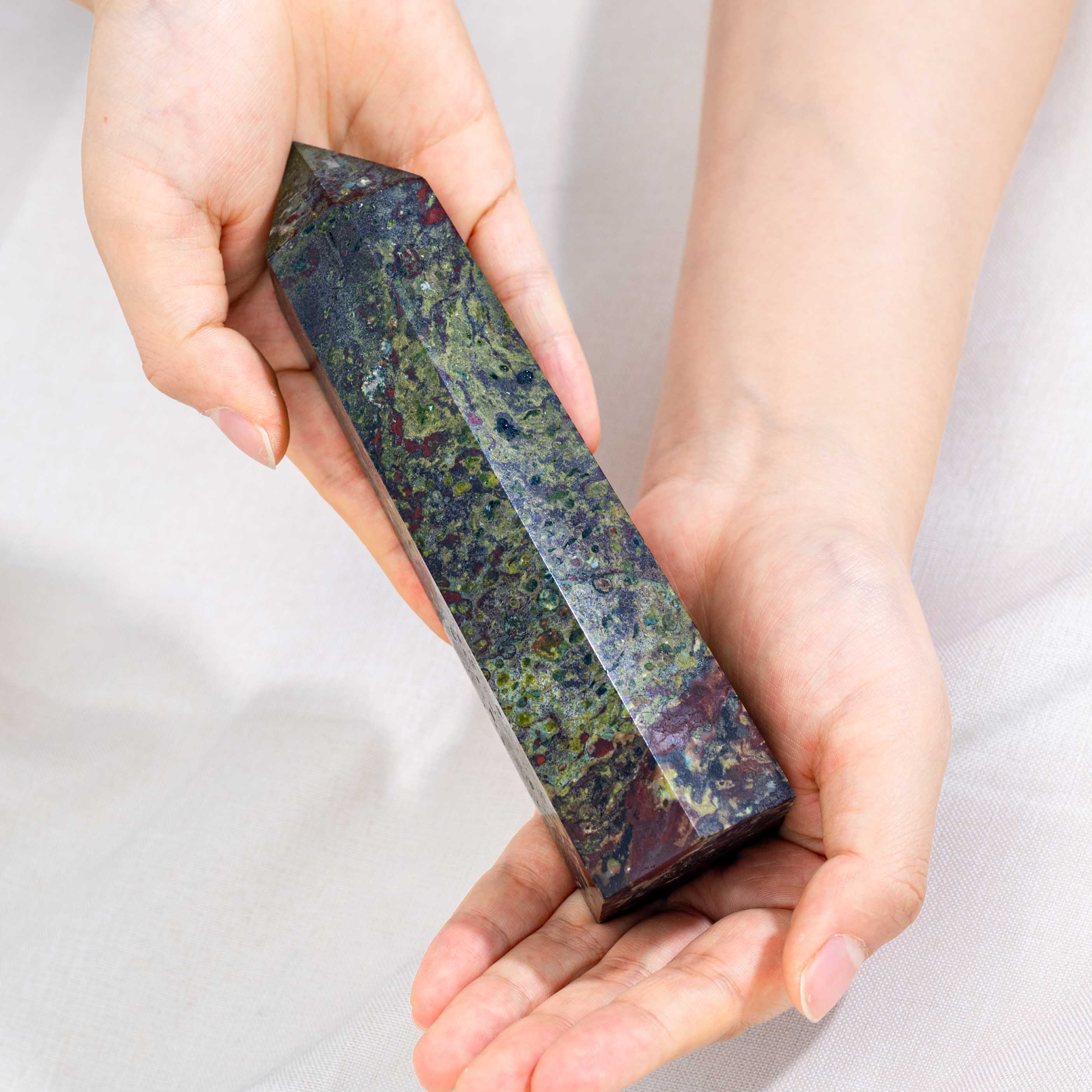 Handcrafted from natural Dragon Blood Stone, this tower enhances creativity and courage, making it a perfect addition to any crystal collection