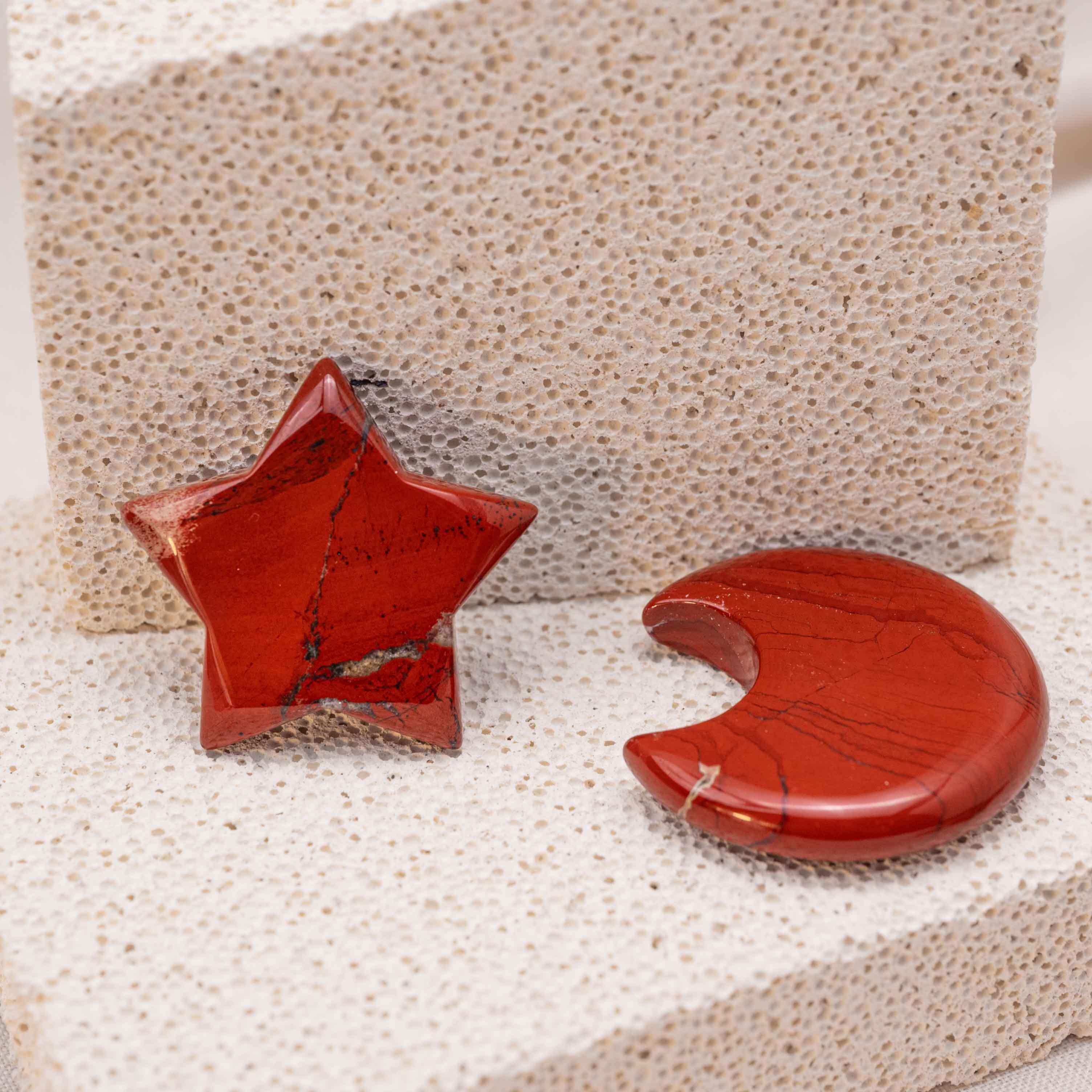 Display of Red Jasper Star/Moon Palm Stone