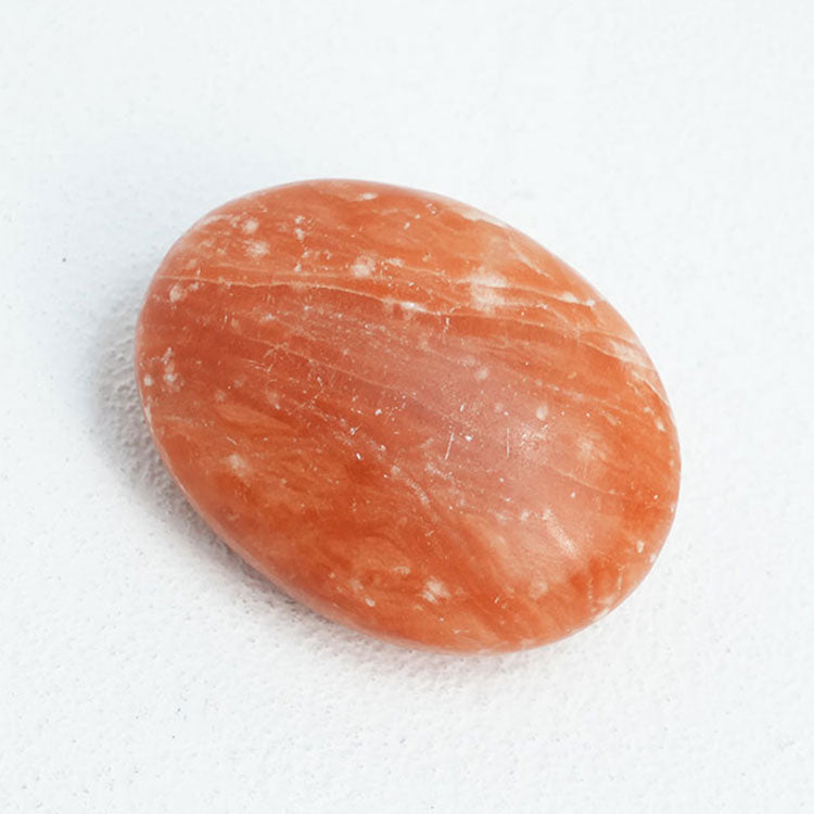 Polished dyed red selenite wand for energy clearing and meditation