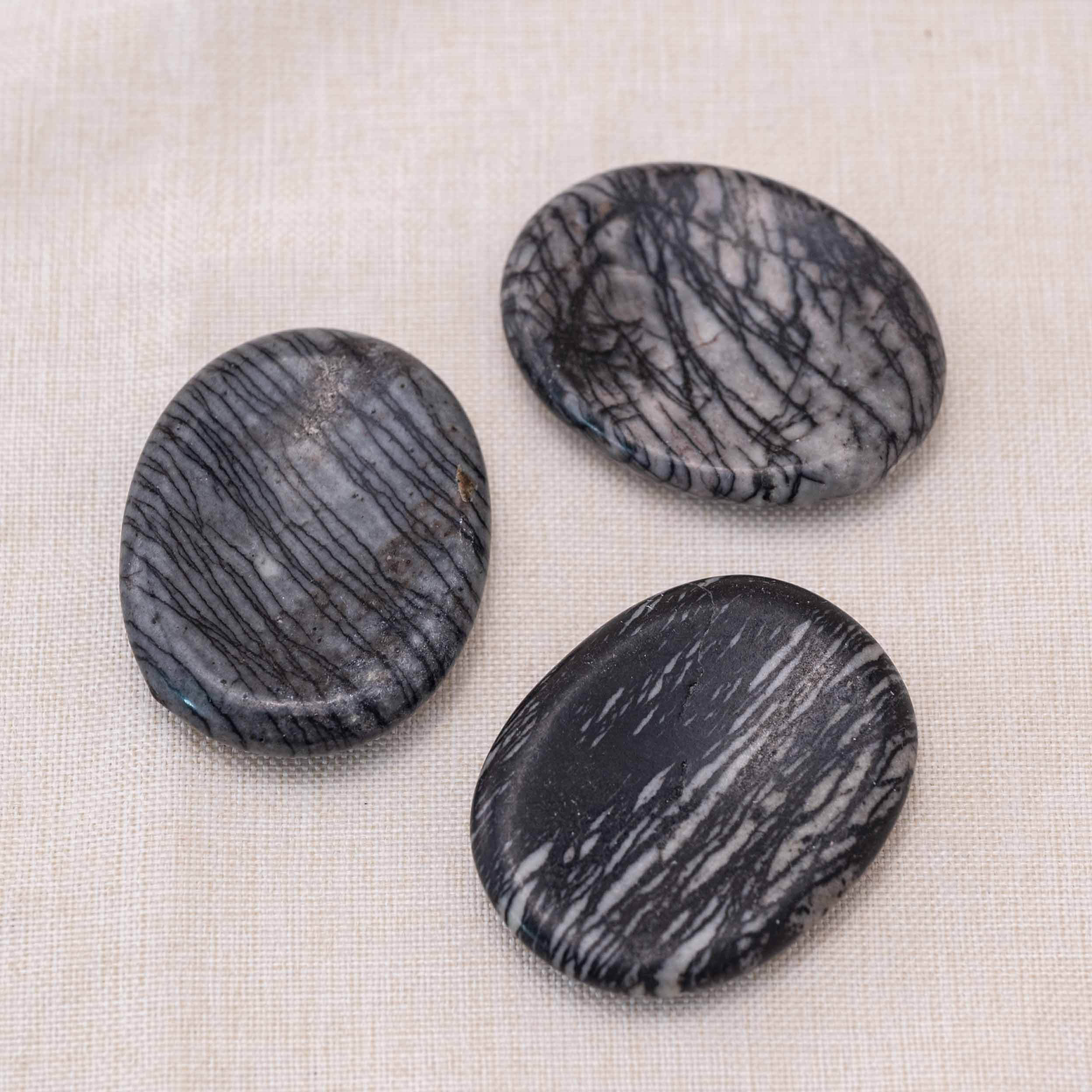 Carry the Black Net Worry Stone to maintain a sense of calm and centeredness