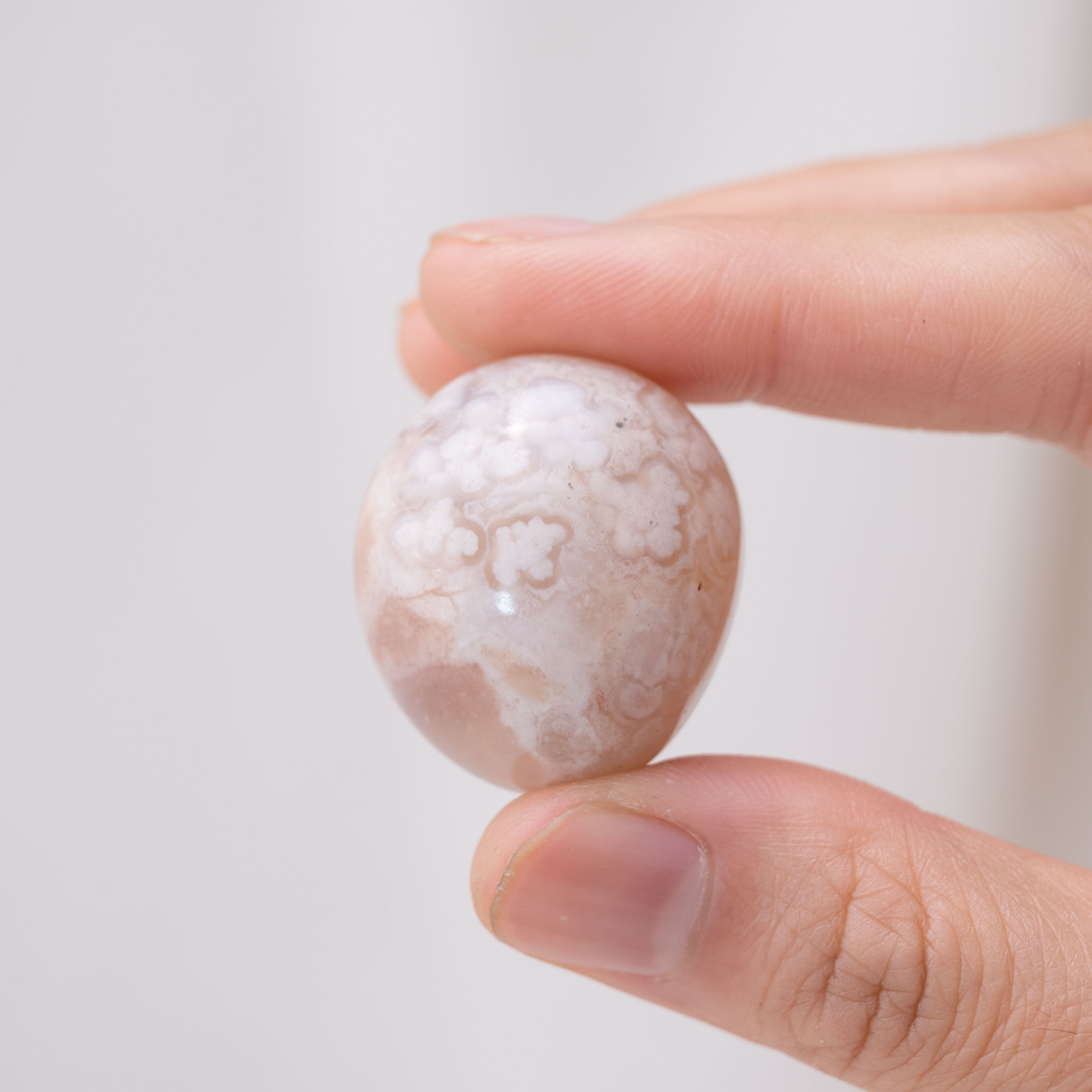 Laid-out Flower Agate tumbled stones for nurturing energy