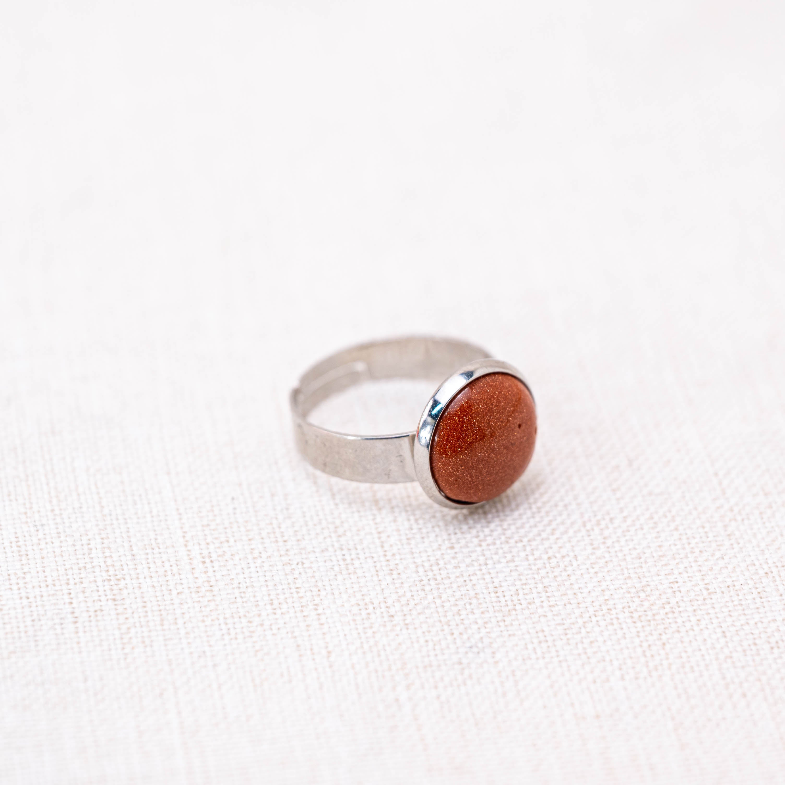 Gold Sand Stone Ring with shimmering inclusions.