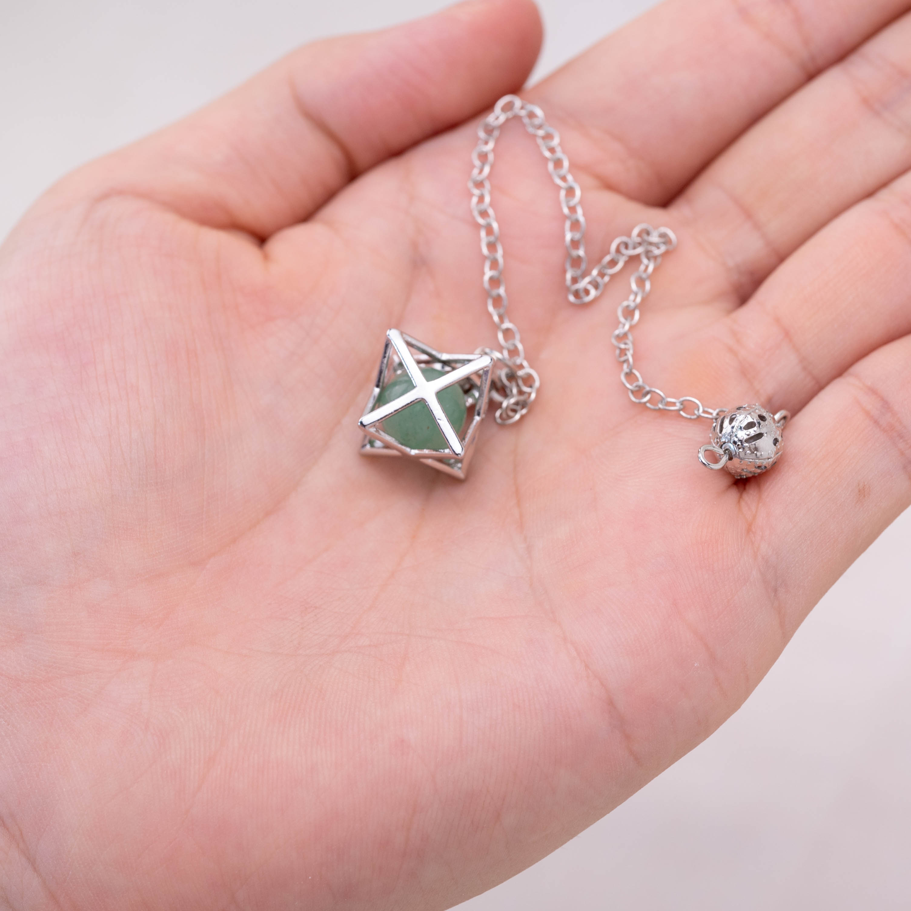 Green Aventurine Merkaba pendulum enhancing prosperity