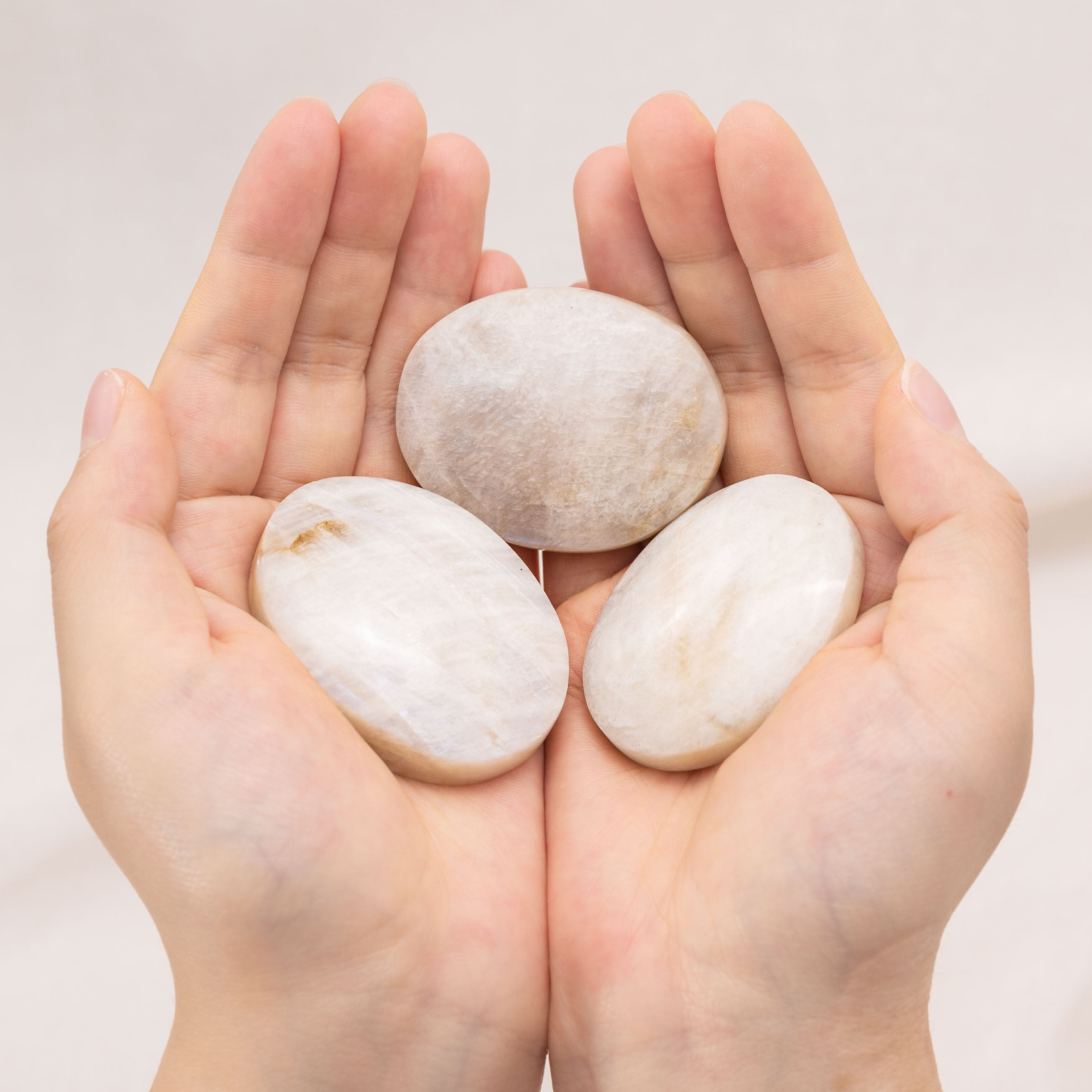 Smooth Blue Moonstone Palmstone ideal for crystal therapy and mindfulness