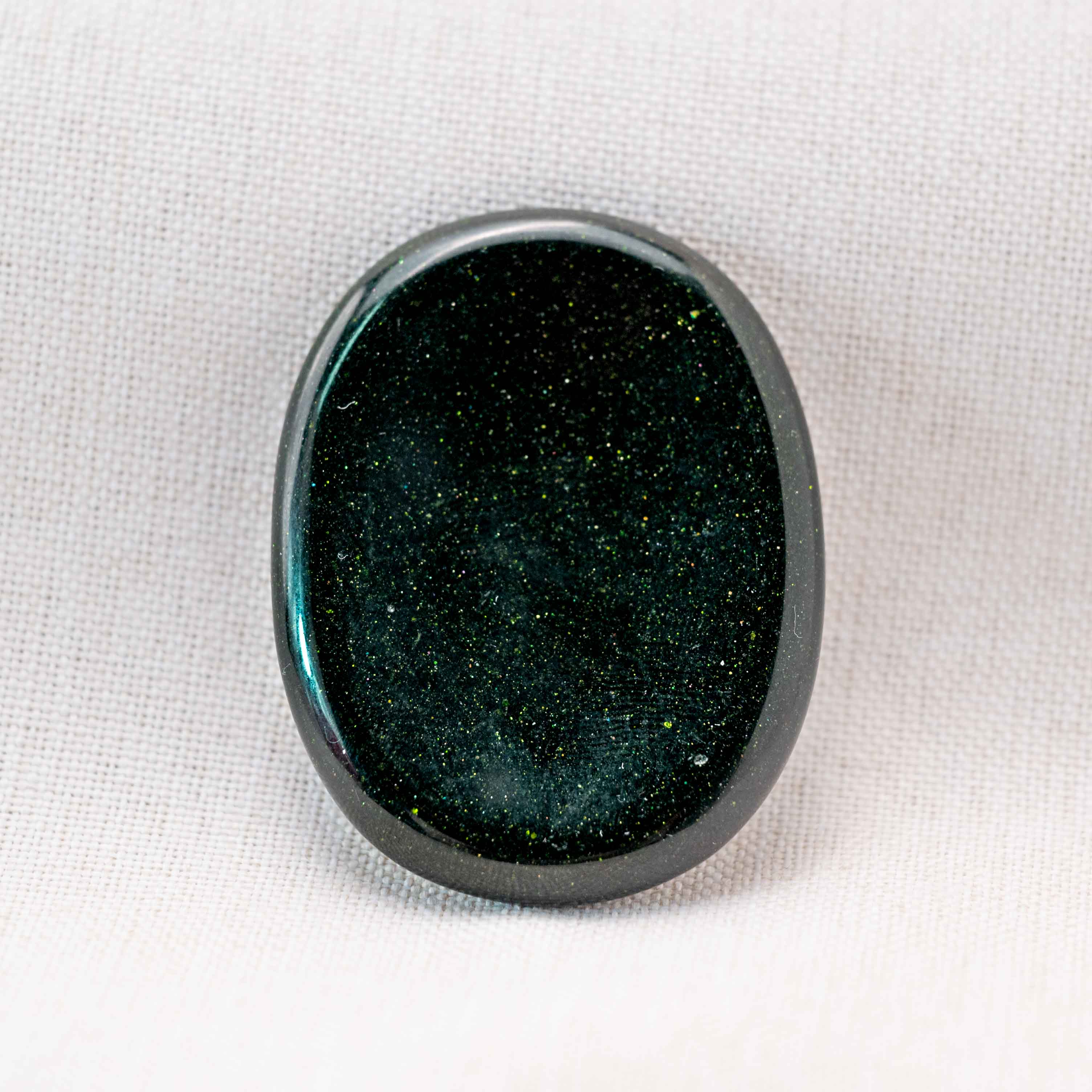 The glittering green surface adds to its beauty