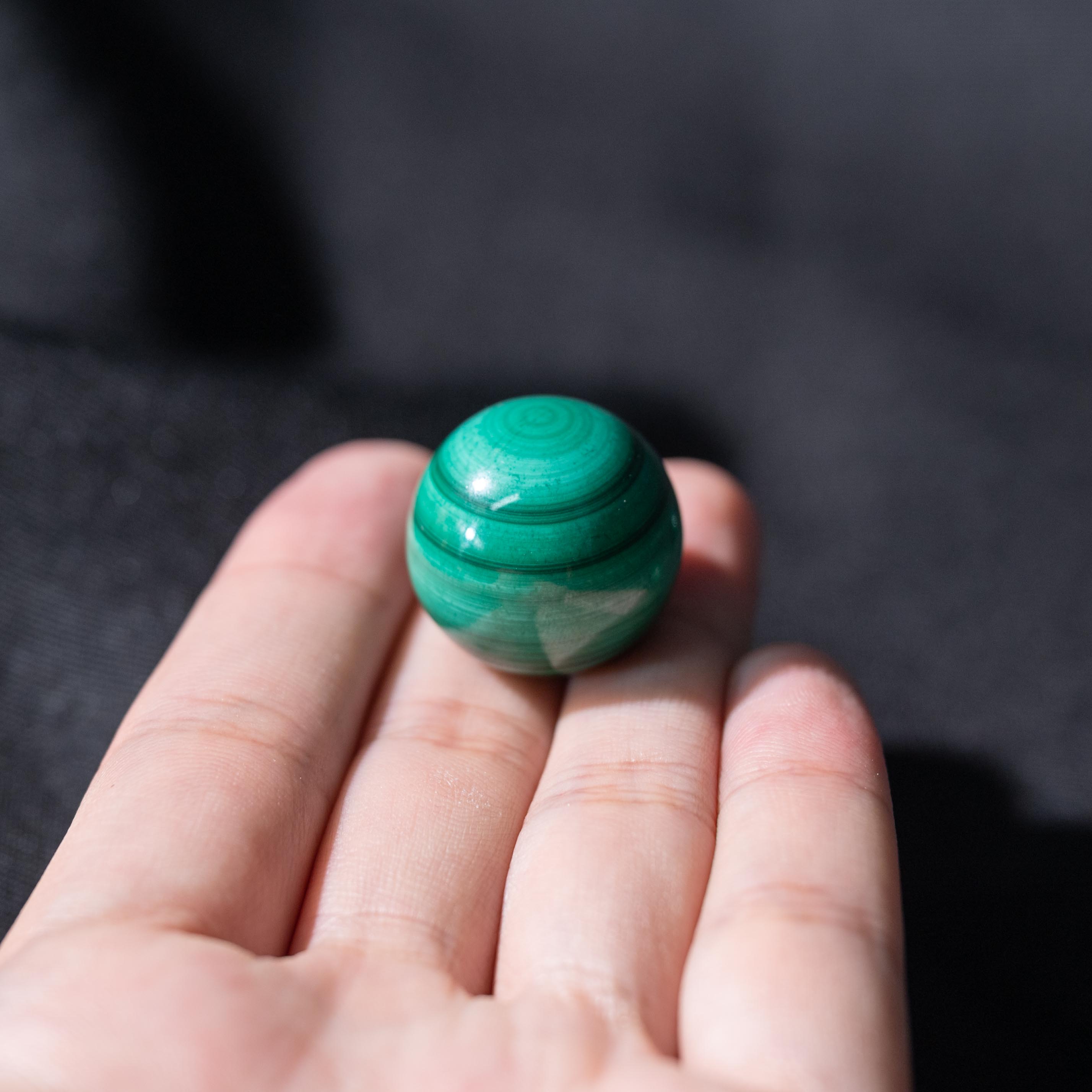 Hand-polished Malachite Mini Sphere for enhancing emotional stability and spiritual growth.
