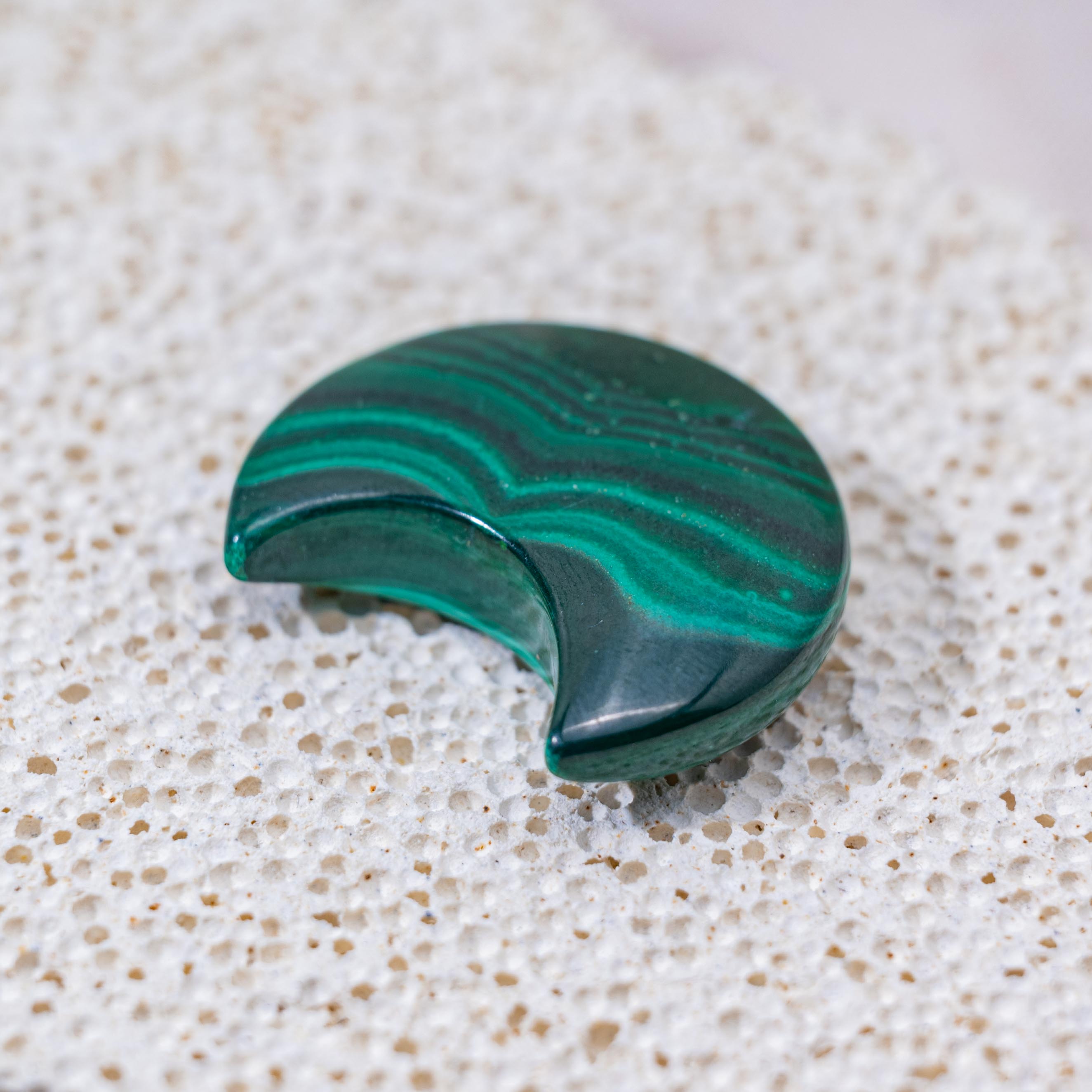The Malachite Moon enhances intuition and emotional balance with its vibrant green hues.