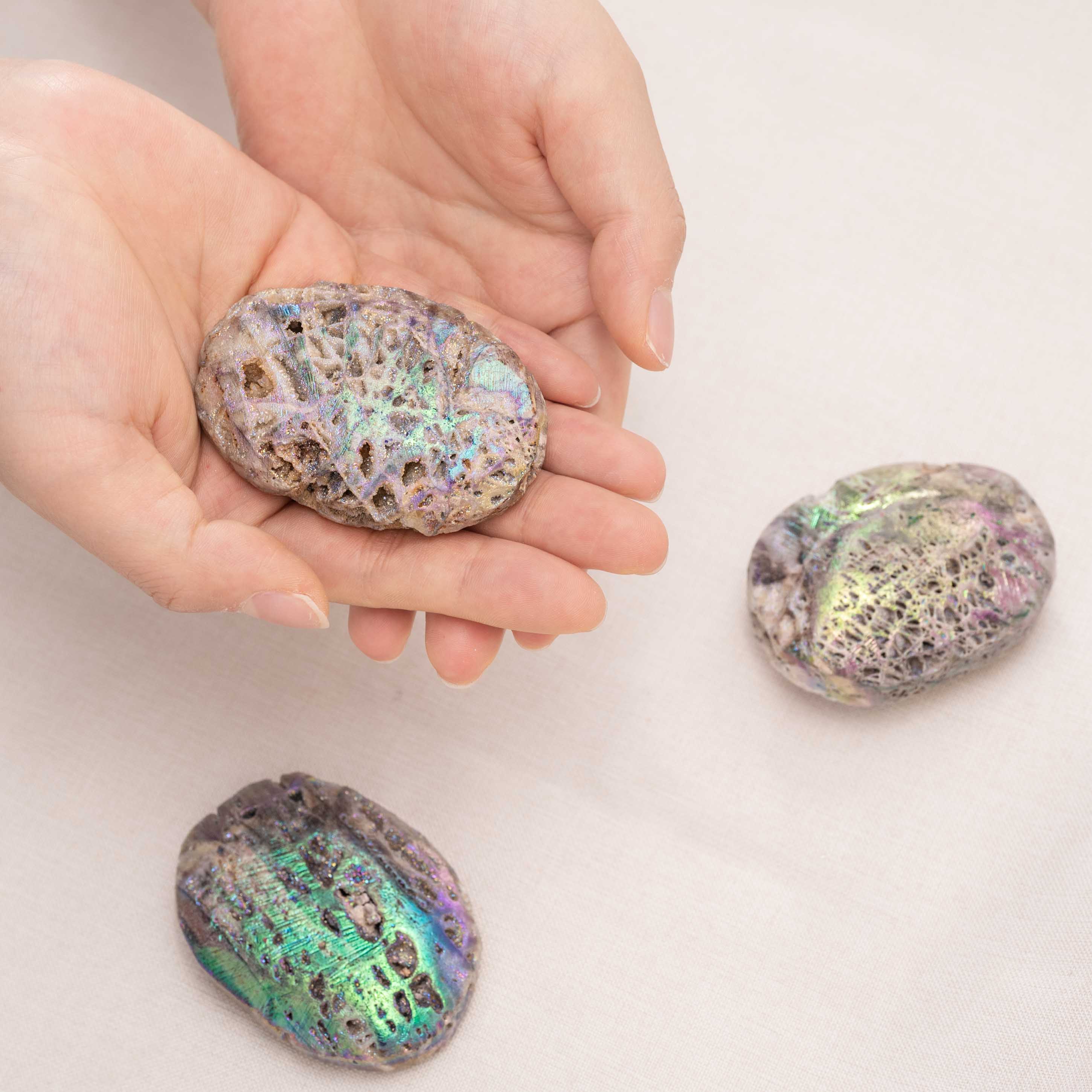 Aura Sphalerite crystal palm stone displaying its brilliant spectral colors