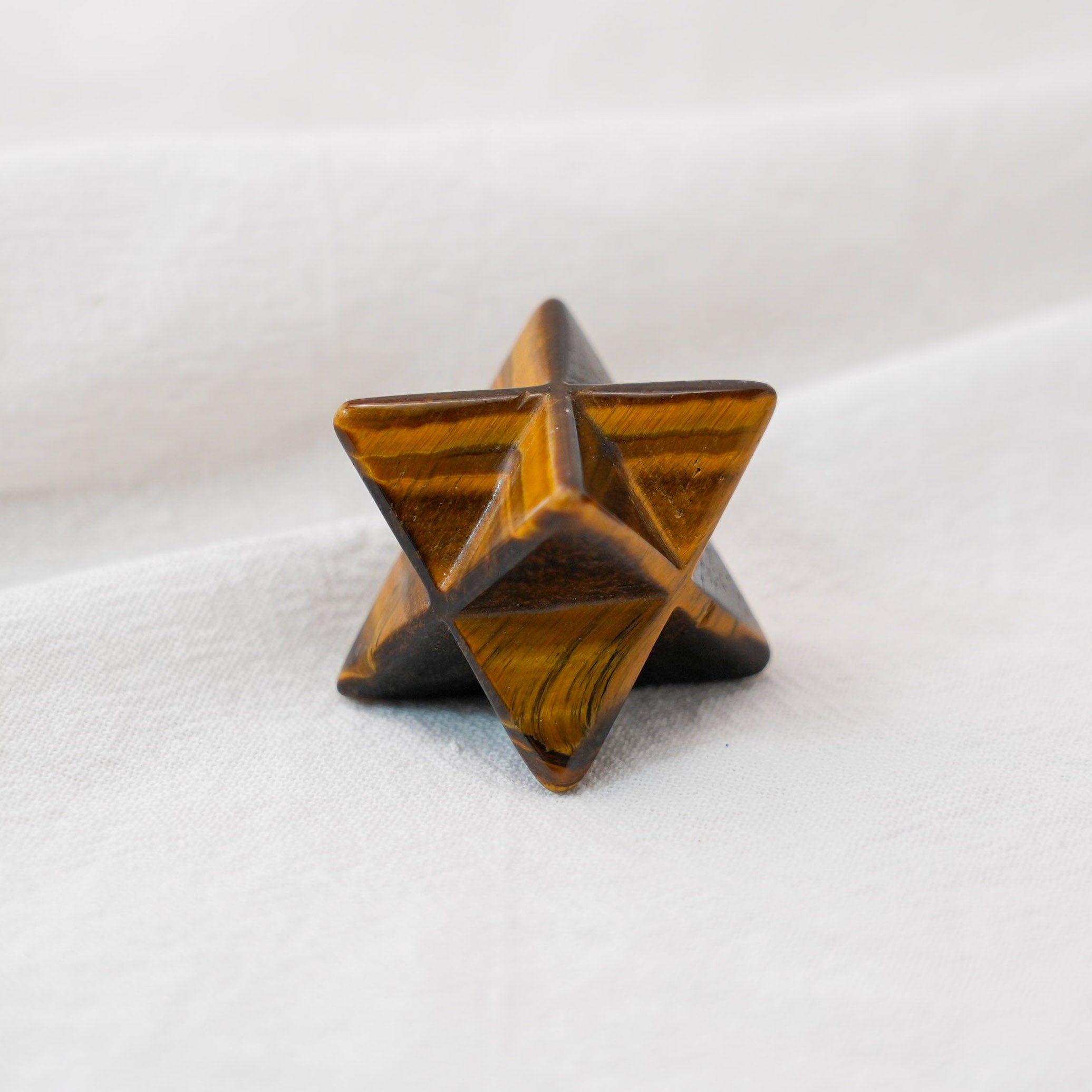 A powerful Tiger Eye Stone Merkaba for enhancing focus and grounding energy