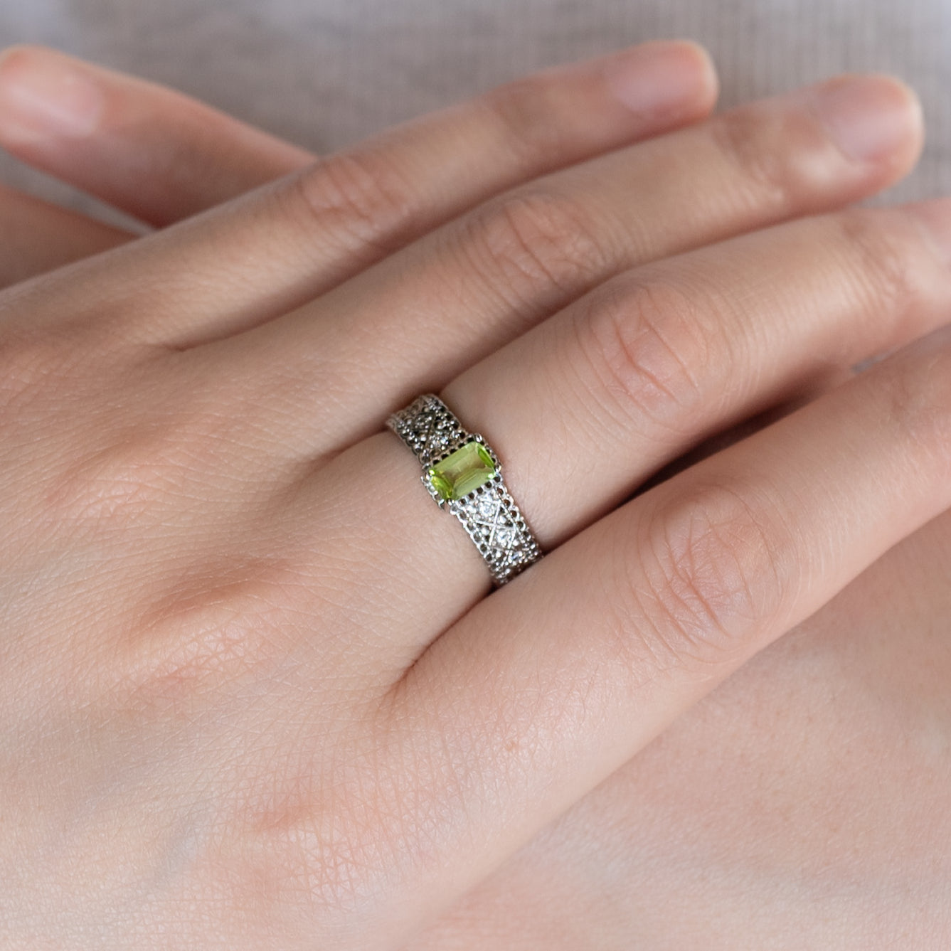 Peridot Cube Ring, symbolizing renewal.