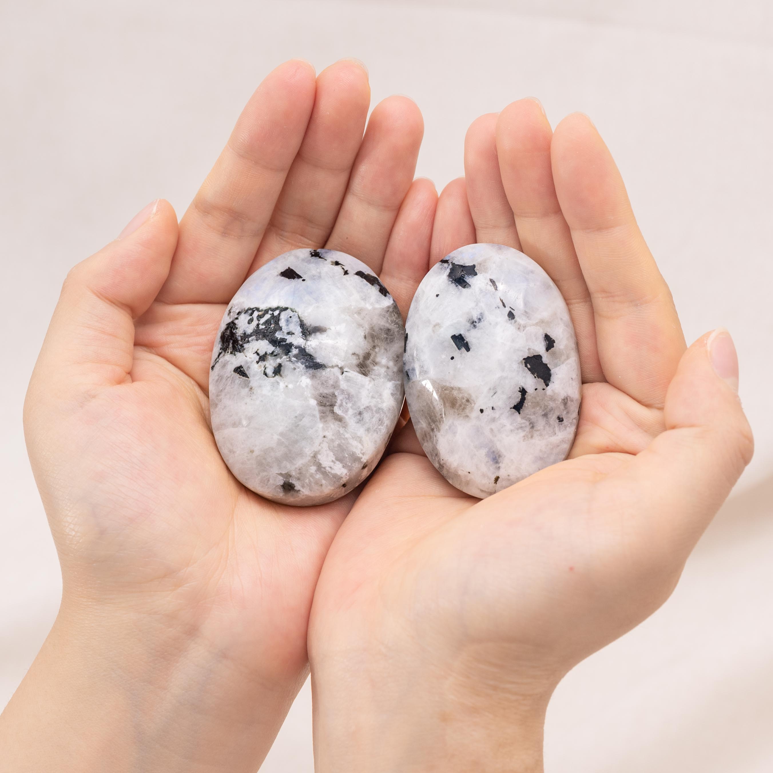 Rainbow Moonstone Palm Stone showcasing stunning blue and white flashes