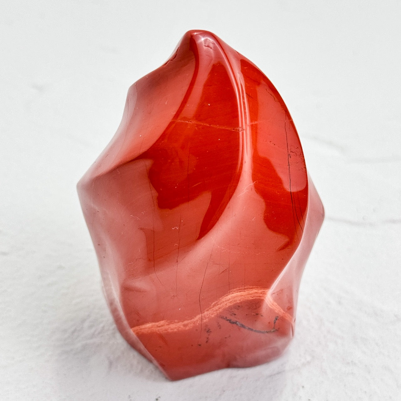 Vivid red and maroon Red Jasper Flame crystal with smooth, polished surface