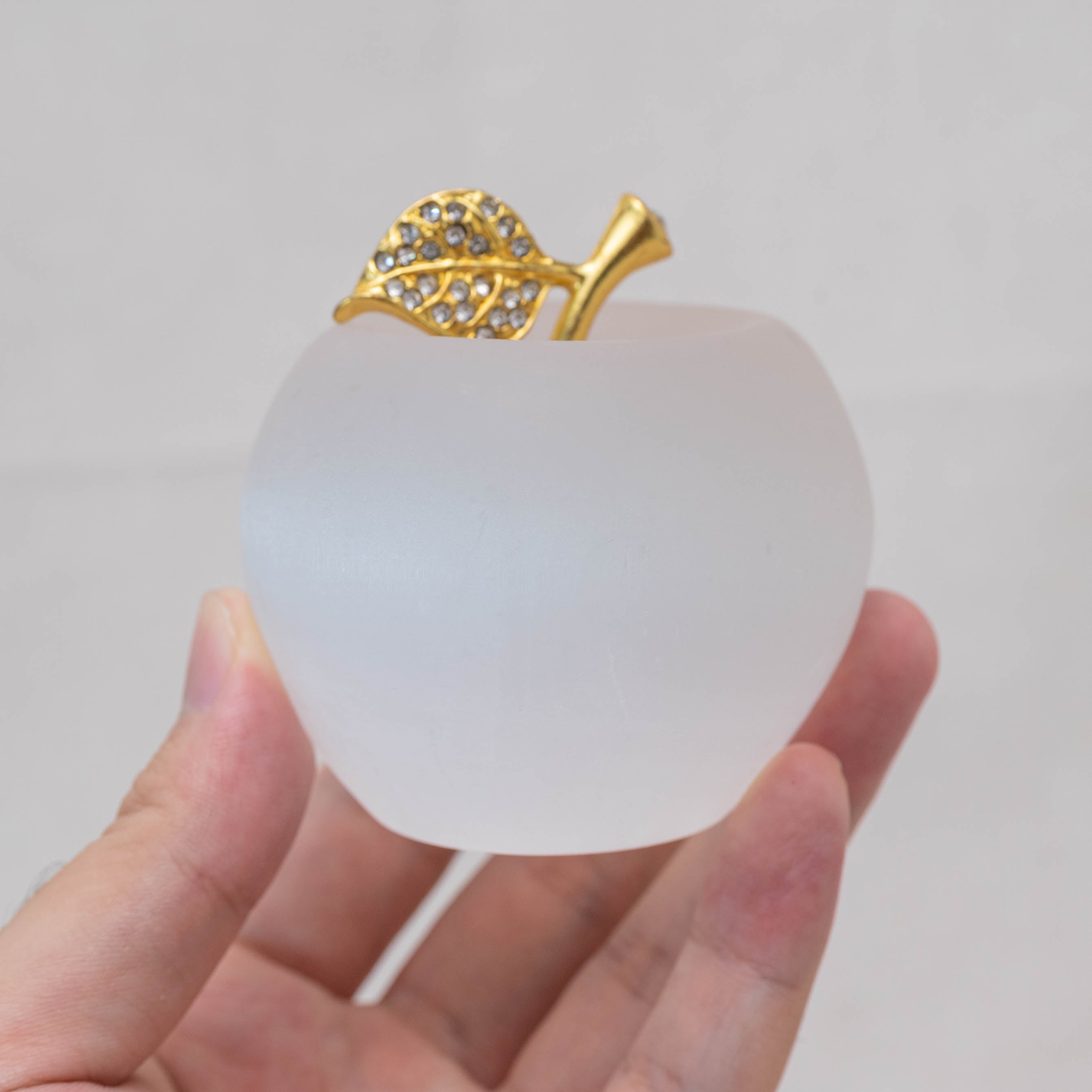 The Selenite Apple Carving boosts productivity in your workspace.