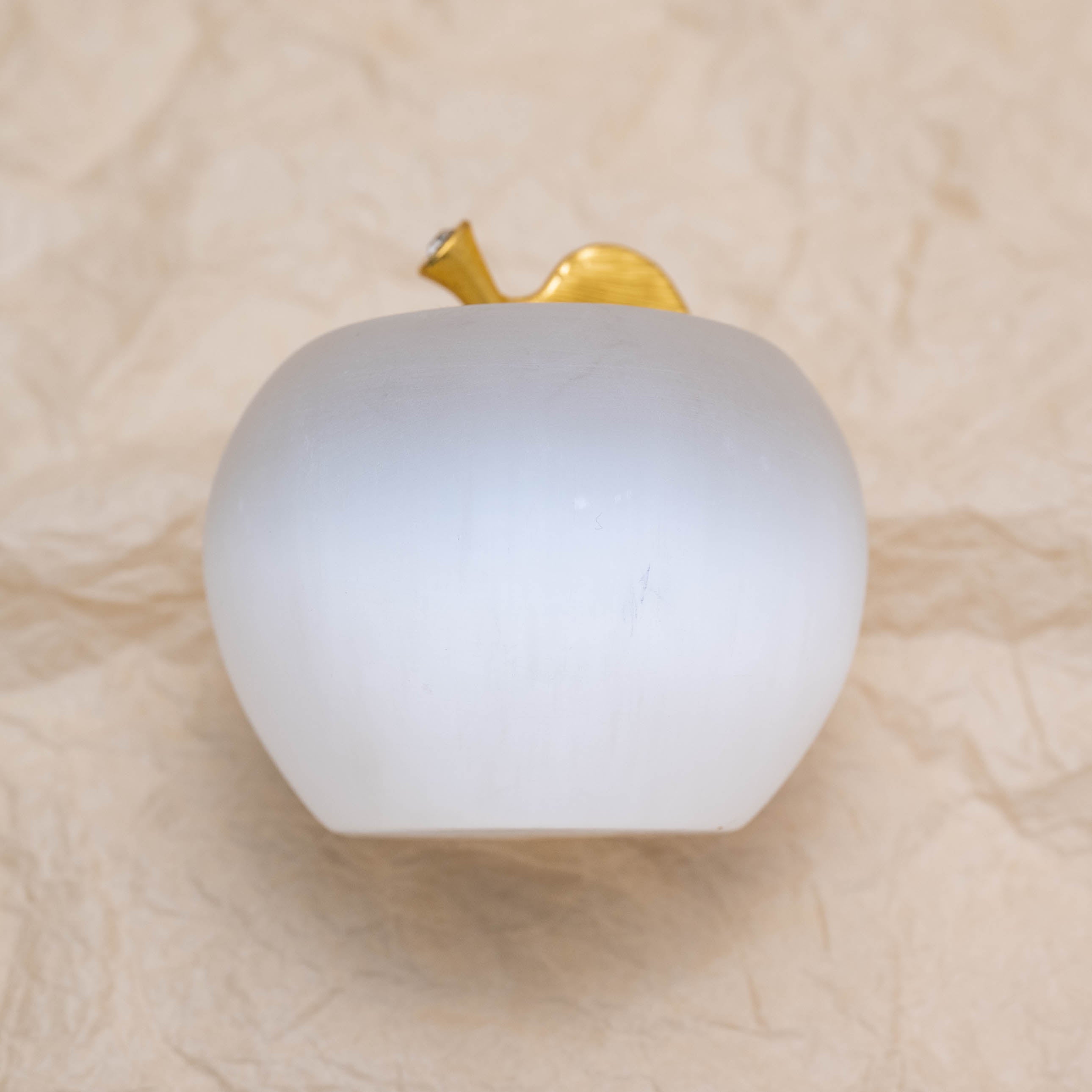 The Selenite Apple Carving provides continuous calming energy.