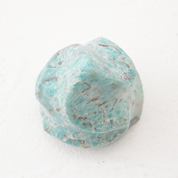Detailed shot of polished smoky quartz and amazonite blend with visible natural patterns.