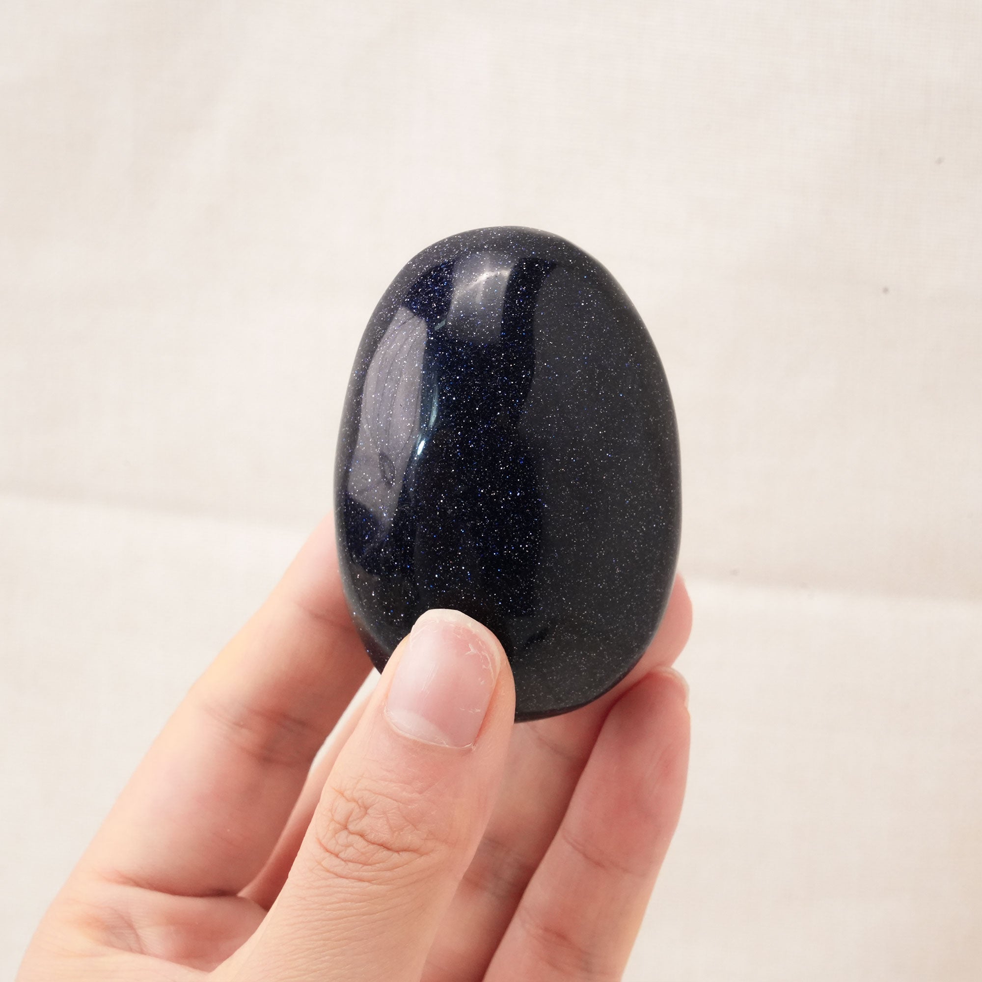 Smooth Blue Sand Stone Palm Stone enhancing spiritual growth and awareness