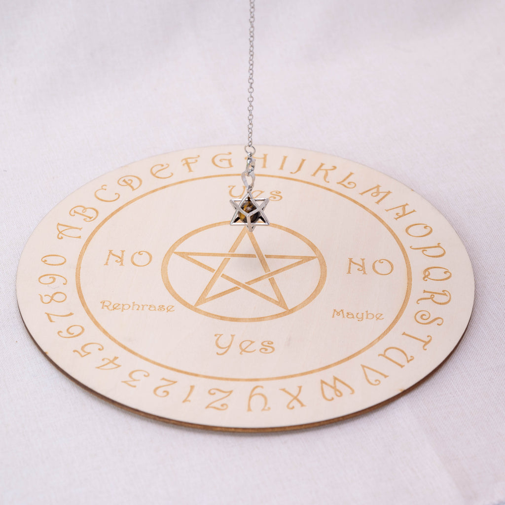 Detailed view of Tiger Eye Stone Merkaba-shaped pendulum