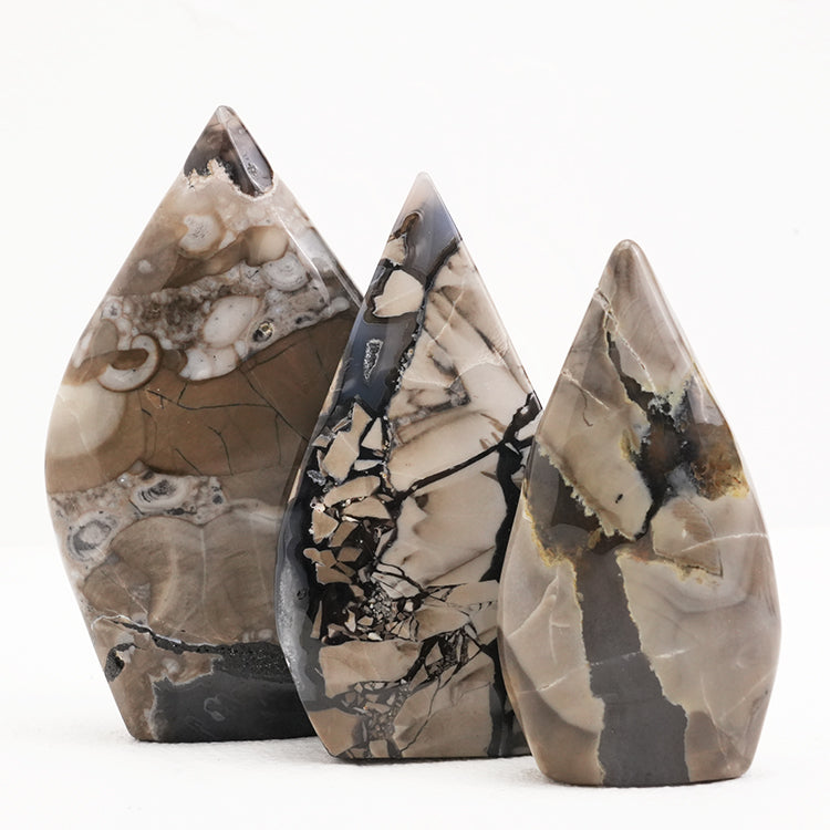 Close-up of Volcanic Agate Freeform Crystal highlighting its intricate natural designs and earthy hues