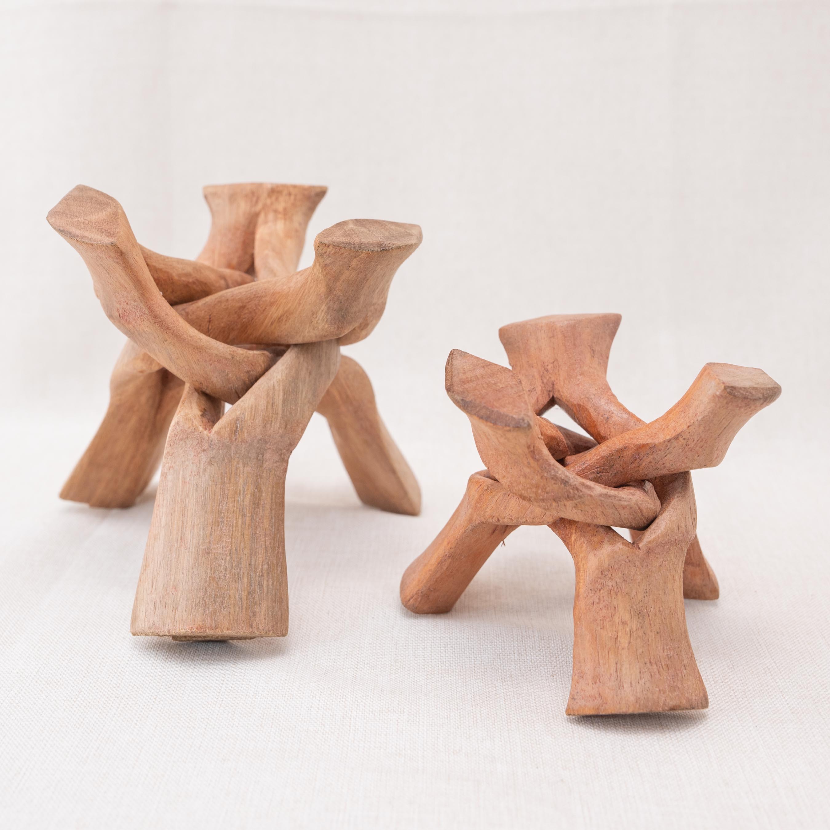 Enhance your meditation space with the natural energy of this wooden tripod stand.